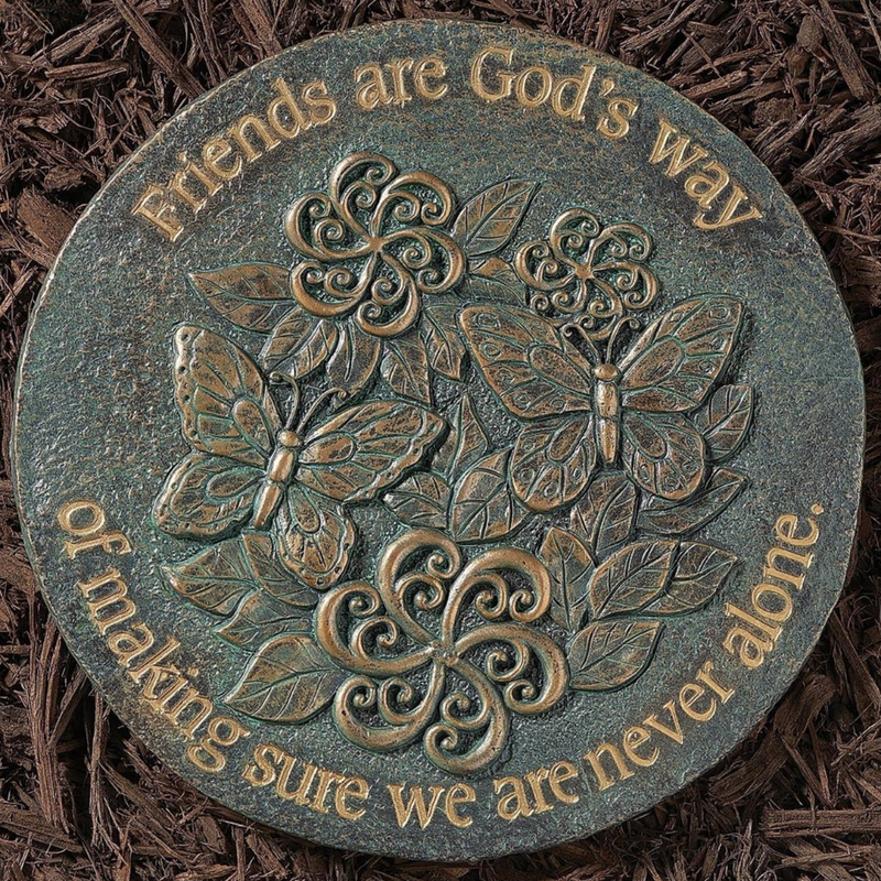 Decorative stone with butterfly and floral design and text on a textured surface