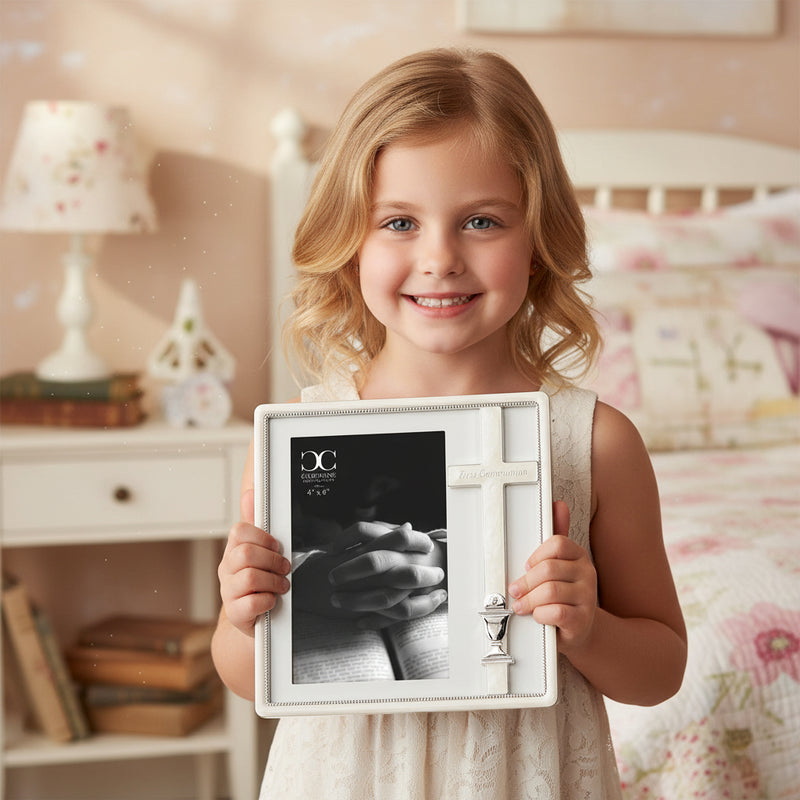 Little girl holding a First Communion picture frame for a 4x6 inch size photo, smiling.