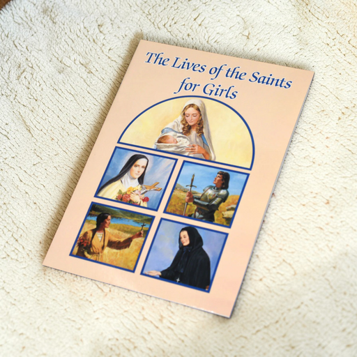 A book with five illustrations of female saints entitled 'The Lives of the Saints for Girls' on a white carpet.