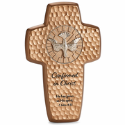Decorative cross with engraved text and Holy Spirit dove emblem on a white background