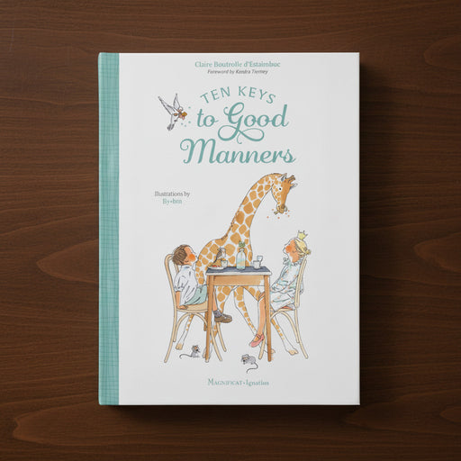 Book titled 'Ten Keys to Good Manners' on a wooden surface