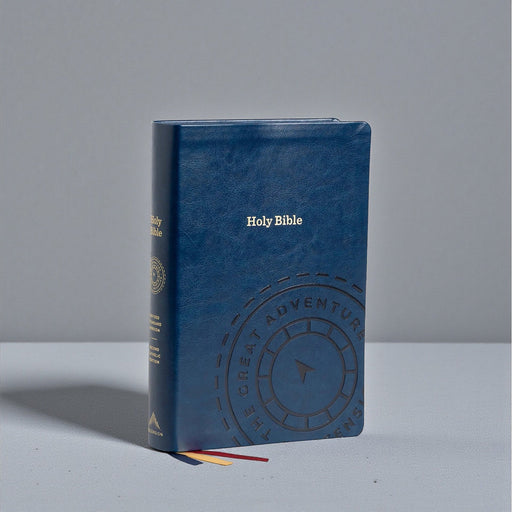 Blue leather-bound Bible with embossed design on a gray background
