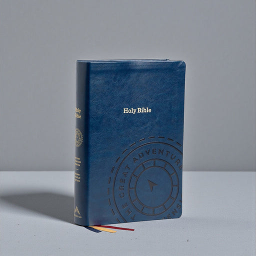 Blue leather-bound Bible with embossed design on a gray background