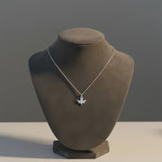 Necklace with a pendant on a mannequin bust against a gray background