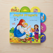 Book titled 'Joyful Prayers' by St. Joseph Kids' Books on a wooden surface