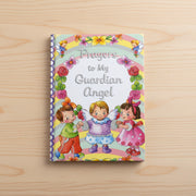 Children's book titled 'Prayers to My Guardian Angel' on a wooden surface