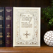 Large, ivory Bible with gold letters