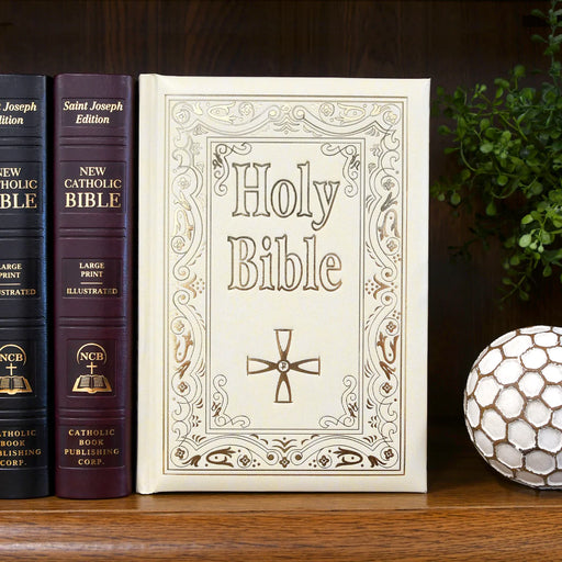 Large, ivory Bible with gold letters