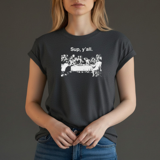 Person wearing a heather gray shirt ith a graphic of Jesus and the Apostles at the Last Supper on a gray background.