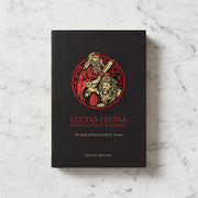 Book titled 'Lectio Divina with the Spiritual Masters' on a marble surface