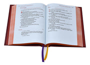 Red liturgical book with Gospel text on a white background