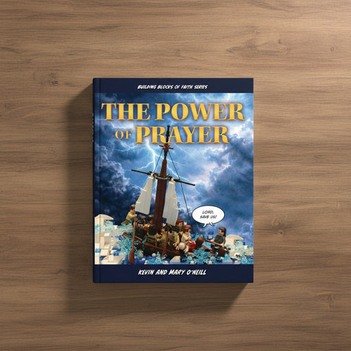 Book titled 'The Power of Prayer' on a wooden surface