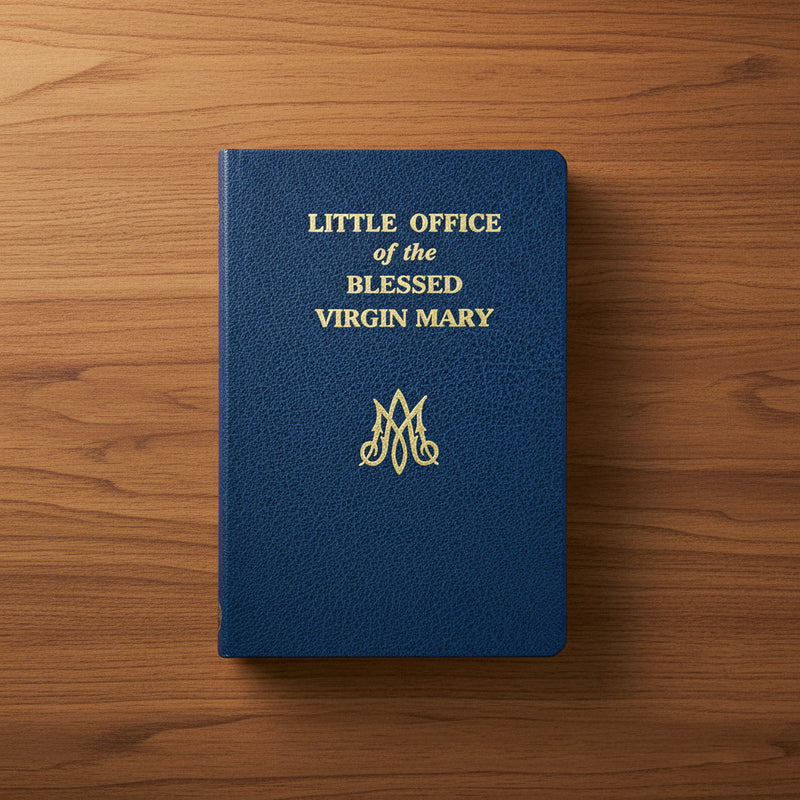Blue book titled 'Little Office of the Blessed Virgin Mary' on a wooden surface