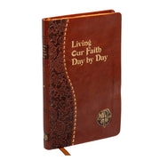 Brown leather book with decorative spine and gold text on a white background