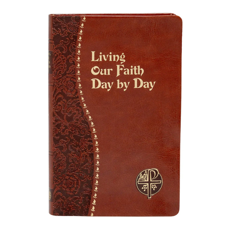 Brown leather notebook with decorative spine and text 'Living Our Faith Day by Day' on a white background