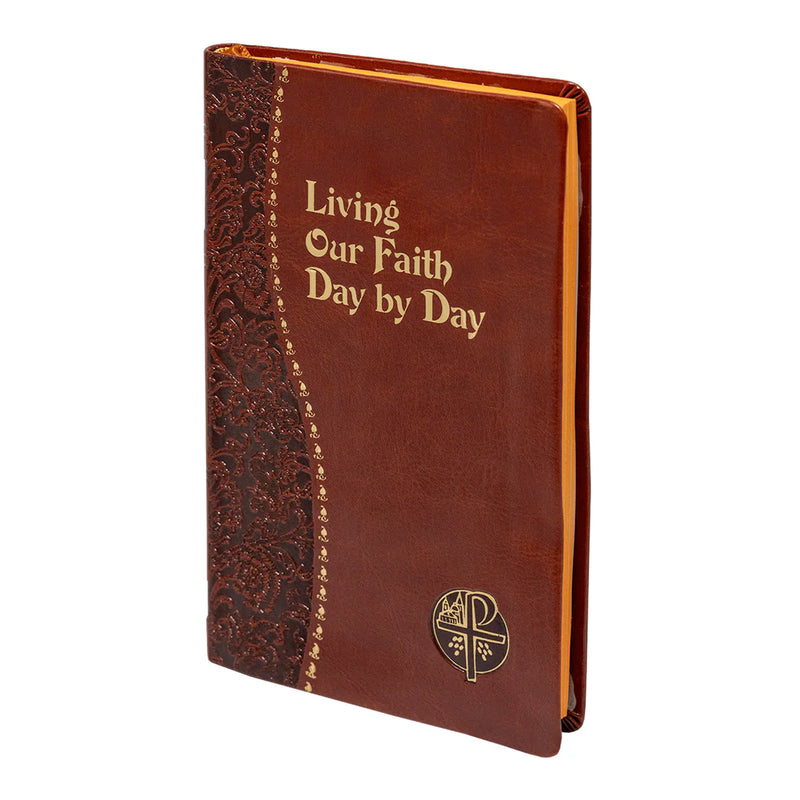 Brown leather book with decorative spine and 'Living Our Faith Day by Day' text on a white background