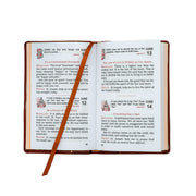 Open book with a red ribbon marker on a white background