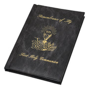 Black book with gold embossed design and text on a white background