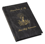Black book with gold text and design, titled 'Remembrance of My First Holy Communion'.