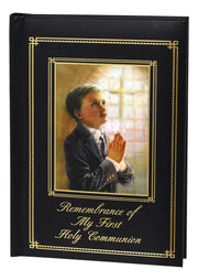 Book with a cover featuring a boy praying and the text 'Remembrance of My First Holy Communion'.