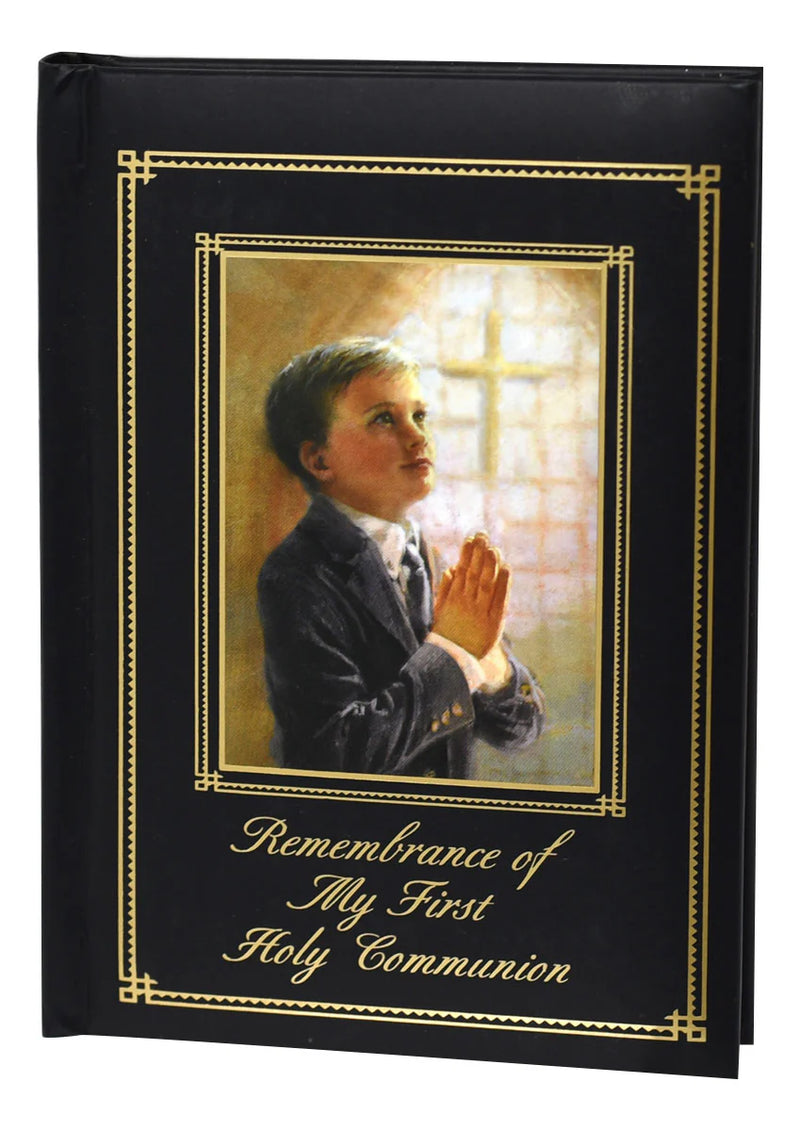 Book with a cover featuring a boy praying and the text 'Remembrance of My First Holy Communion'.