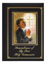 Memorabilia album with a boy praying and cross, titled 'Remembrance of My First Holy Communion'.