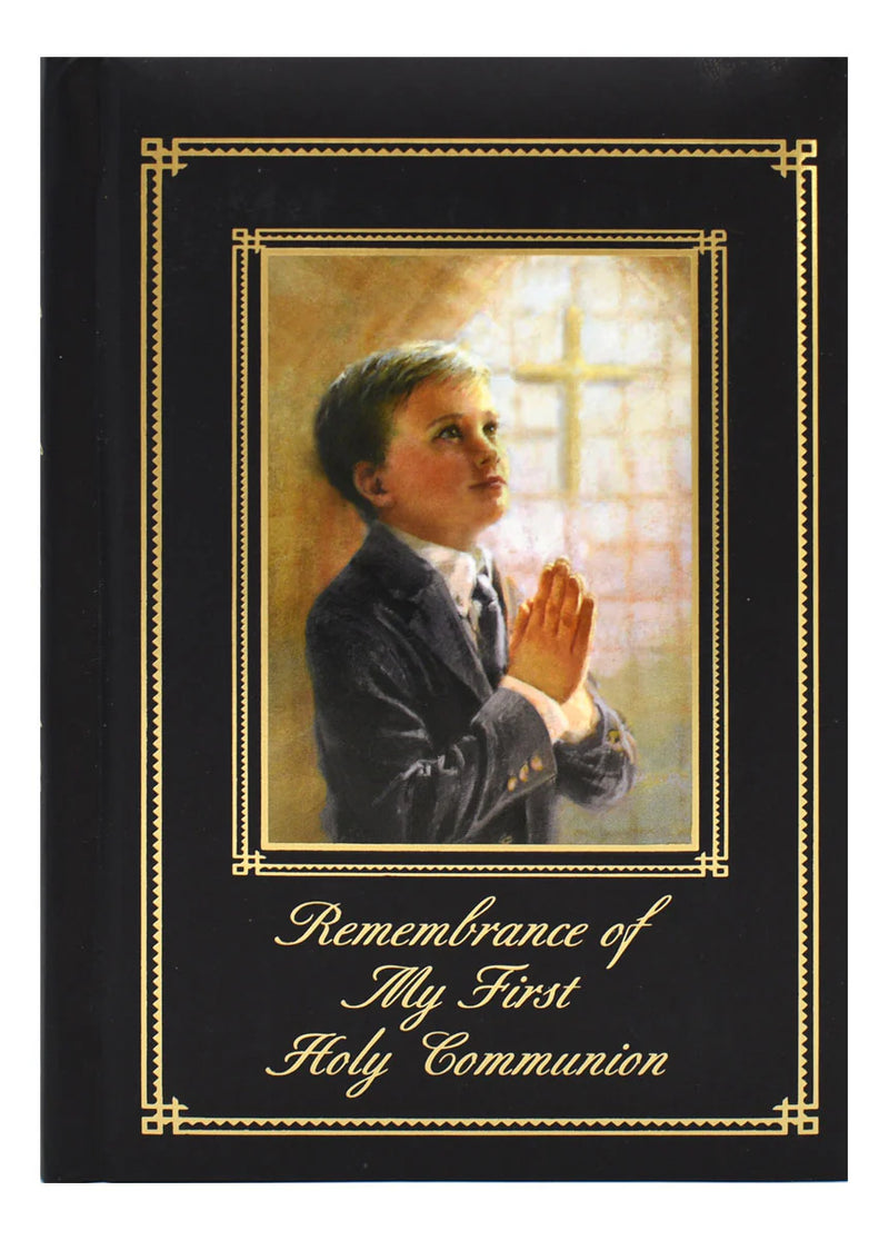 Memorabilia album with a boy praying and cross, titled 'Remembrance of My First Holy Communion'.
