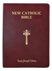 New Catholic Bible with a gold cross on a maroon cover