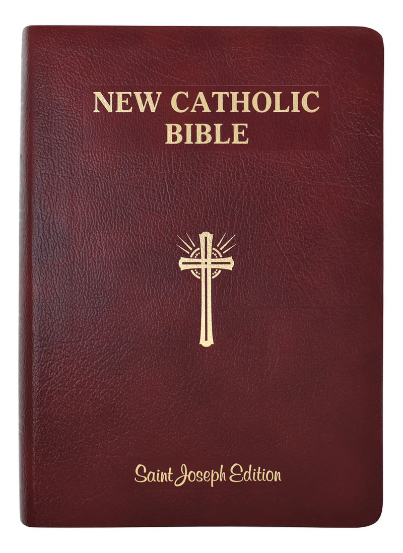 New Catholic Bible with a gold cross on a maroon cover