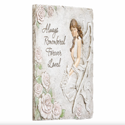 Decorative memorial plaque with angel and roses design on a white background