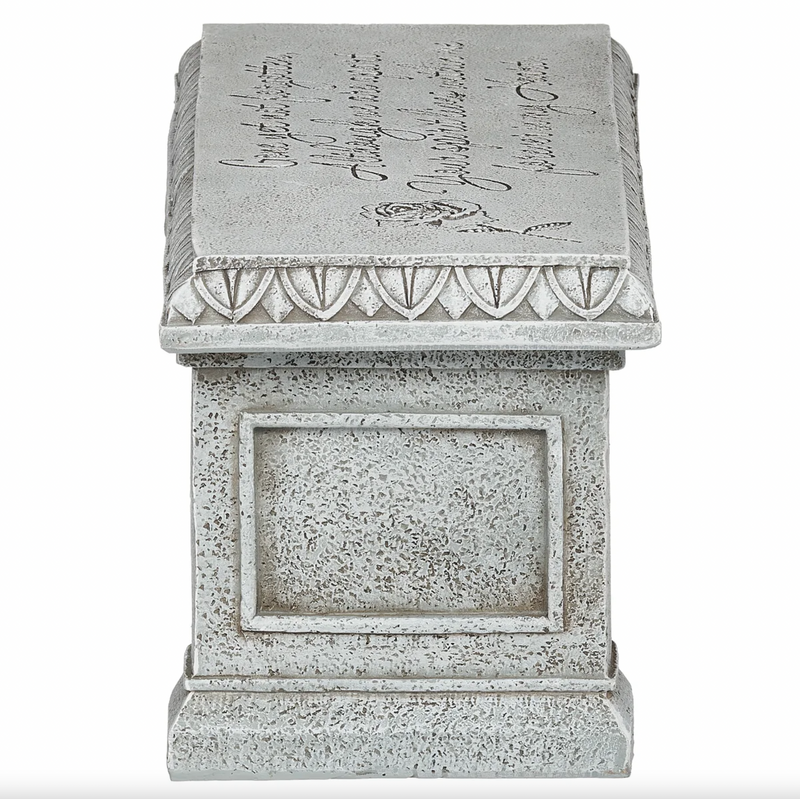 Decorative memorial bench with engraved text and design on a white background