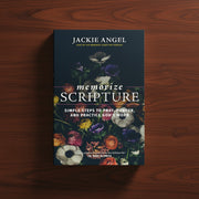 Book titled 'Memorize Scripture' by Jackie Angel on a wooden surface