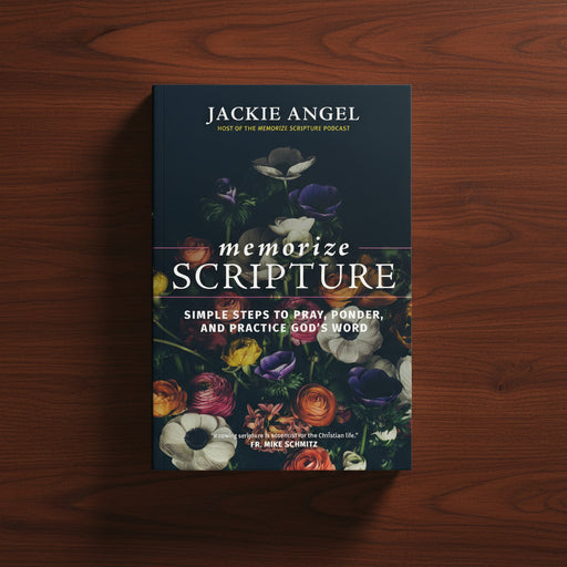 Book titled 'Memorize Scripture' by Jackie Angel on a wooden surface