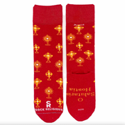 Vibrant red and gold socks featuring images of different monstrances with the Blessed Sacrament on a white background