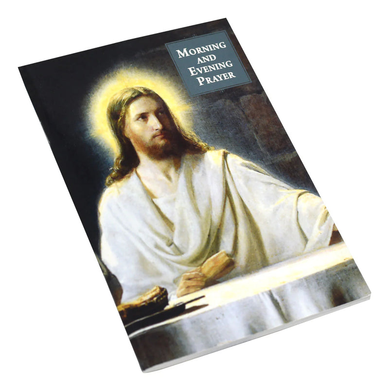 Booklet with an illustration of Jesus in white robes on the cover, titled 'Morning and Evening Prayer'.
