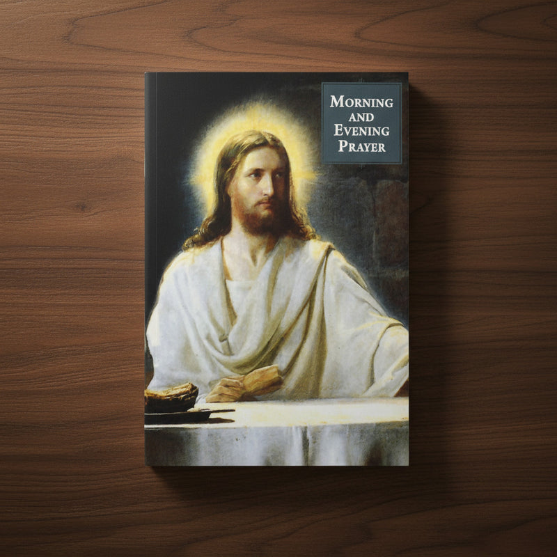 Booklet with an illustration of Jesus in white robes on the cover, titled 'Morning and Evening Prayer' on a wood background.