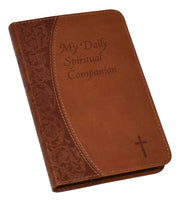 Brown leather book with 'My Daily Spiritual Companion' text and cross on a white background
