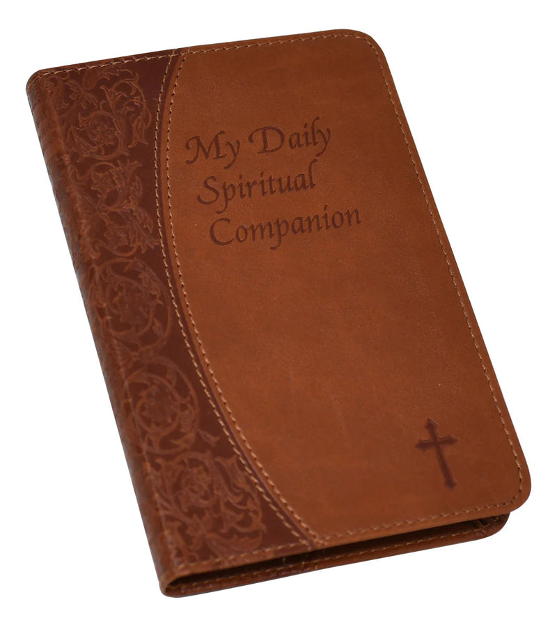 Brown leather book with 'My Daily Spiritual Companion' text and cross on a white background