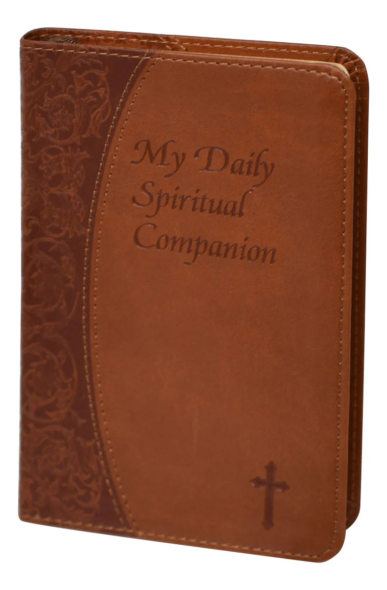 Brown leather book with 'My Daily Spiritual Companion' text and cross design on a white background