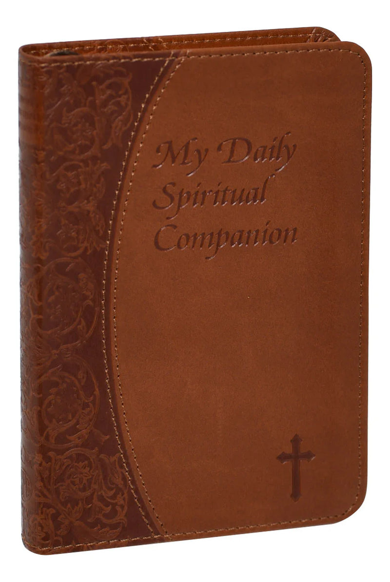 Brown leather book with 'My Daily Spiritual Companion' text and cross design.