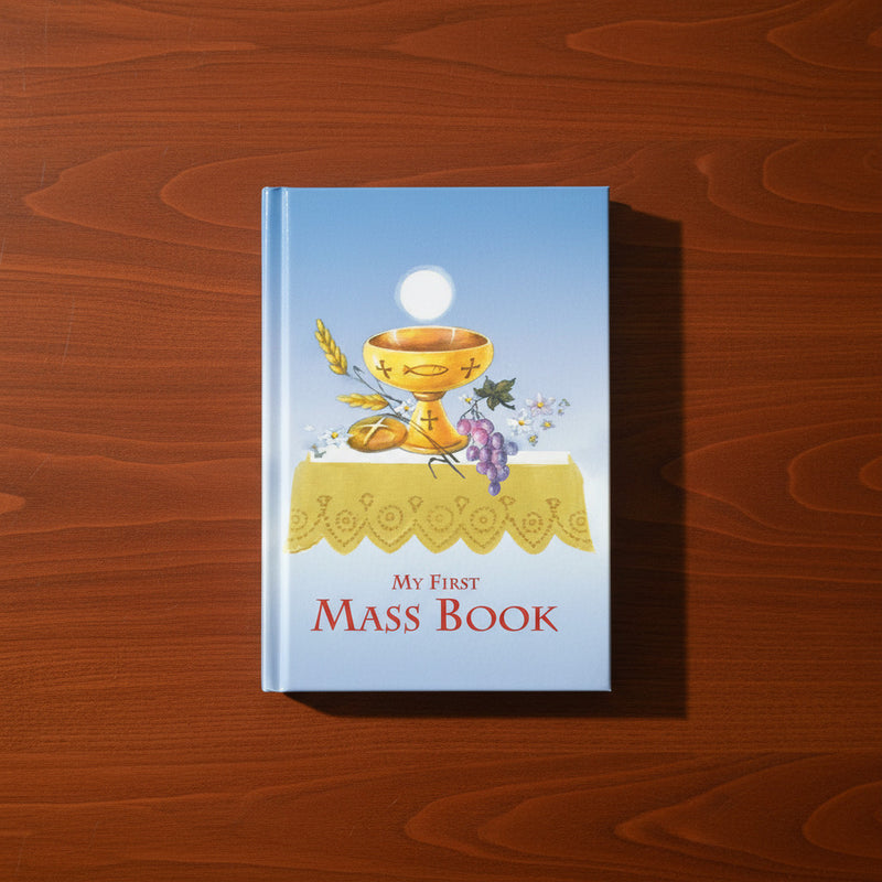 Book titled 'My First Mass Book' with a chalice and Host illustration on a wooden surface
