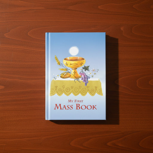 Book titled 'My First Mass Book' with a chalice and Host illustration on a wooden surface