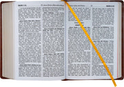 Open book with text and a yellow highlighter on a white background