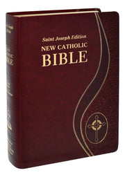 Maroon New Catholic Bible with gold text and cross emblem on a white background