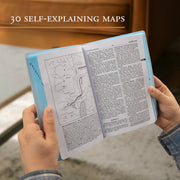 Person holding a book with maps and text, with '30 Self-Explanining Maps' text at the top.