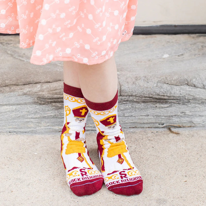 Child wearing brightly colored St. Nicholas socks