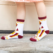 Child wearing brightly colored St. Nicholas socks