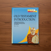 Book titled 'Old Testament Introduction' on a wooden surface