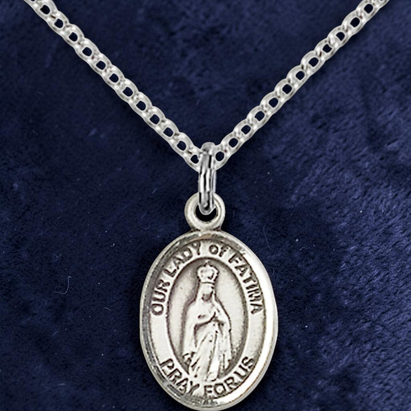Silver necklace with a pendant on a dark blue background