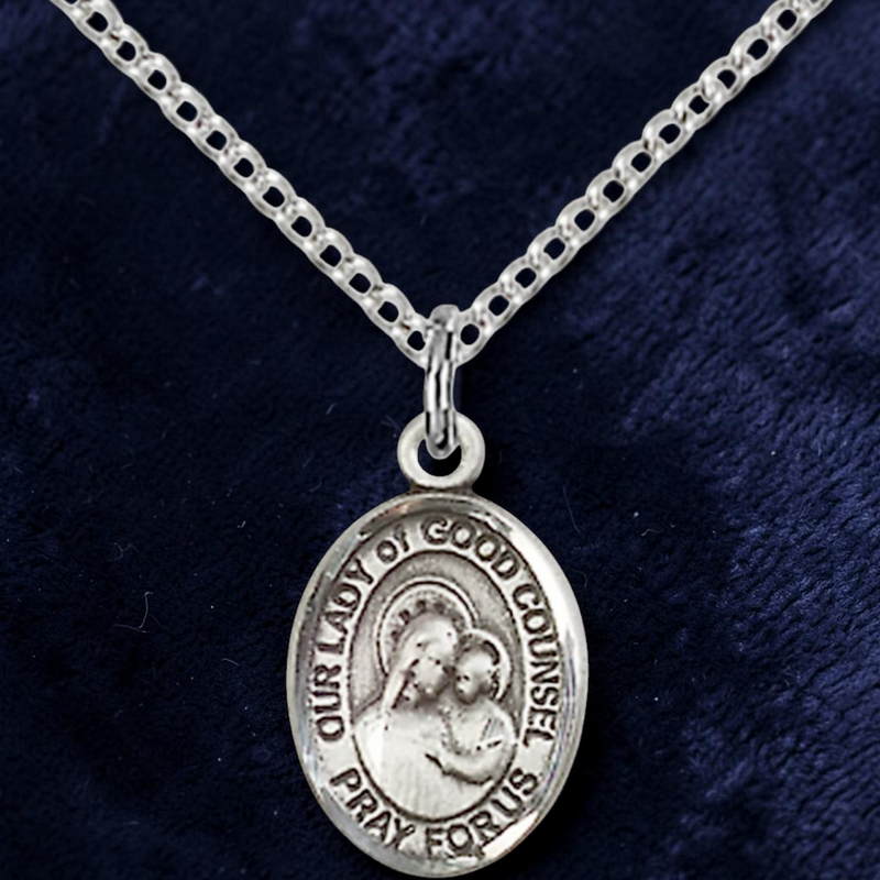 Silver necklace with a pendant on a dark blue background